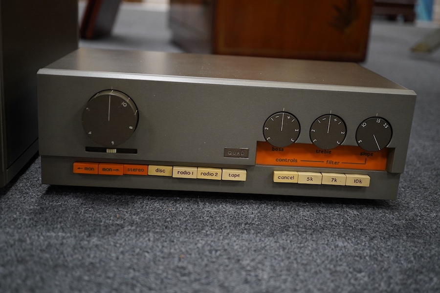 A Quad 303 stereo amplifier and a Quad 33 pre-amp, both boxed. Condition - good.